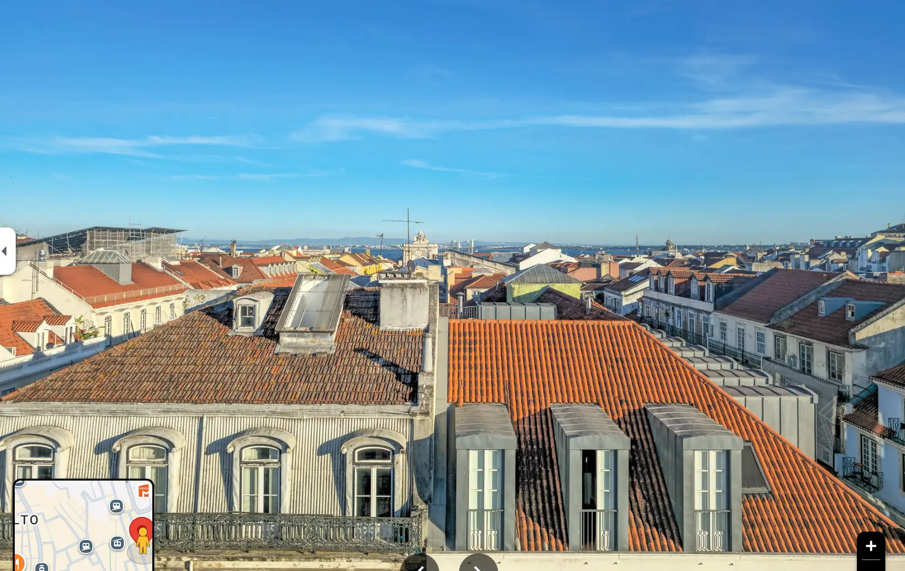 Open view over the Baixa rooftops and the Tagus river